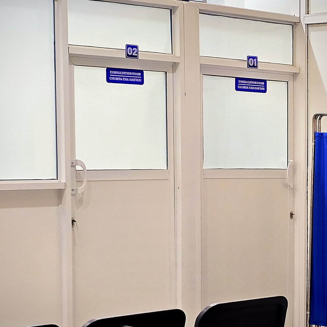 Consultation rooms 01 and 02 at MacWish Medical Centre, signed in English and Kiswahili