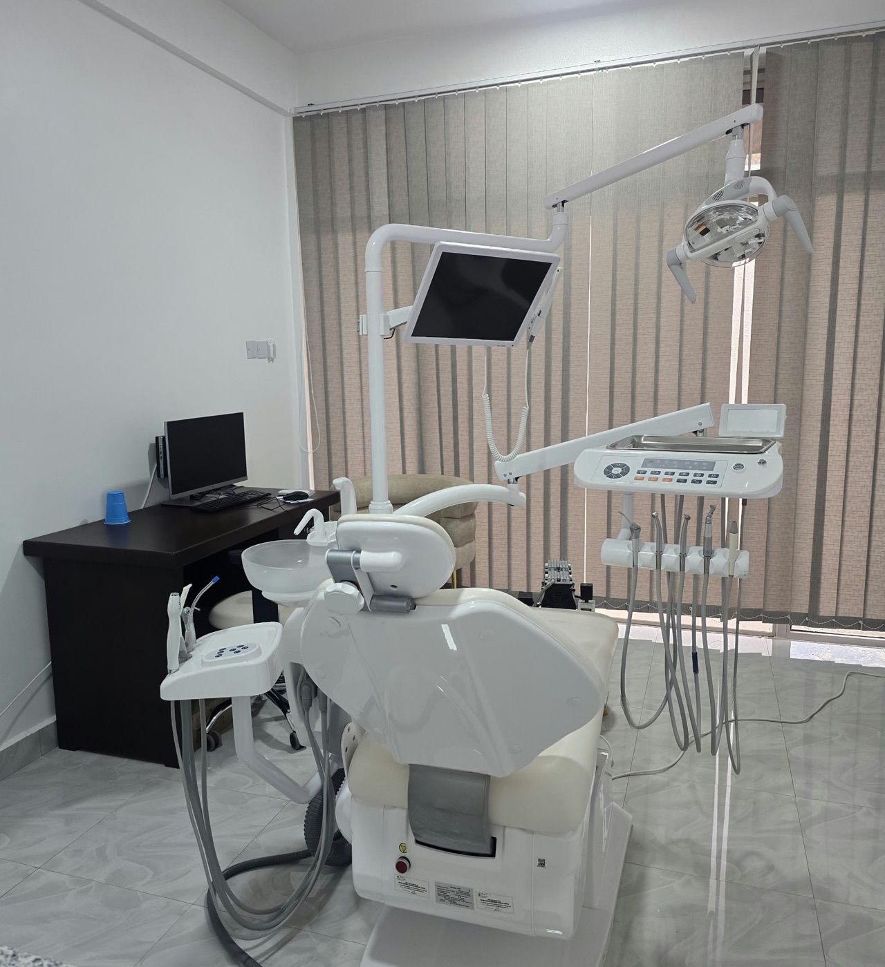 The dental room at MacWish Medical Centre, with its dental chair and treatment unit